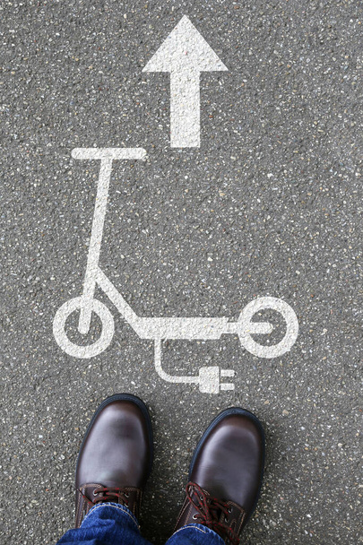 Man people electric scooter e-scooter road sign arrow eco friendly mobility portrait format city transport transportation - Foto, Imagem