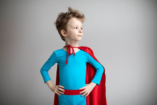 Portrait of a boy in a superhero costume. Success, motivation concept. - Foto, immagini