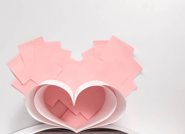 Gracieuze hartvorm gemaakt van vellen wit papier tegen een achtergrond van roze harten gemaakt van vierkante elementen, close-up, ondiepe scherptediepte, kopieer ruimte - Foto, afbeelding