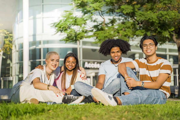 Group of multiethnic friends having fun together with self portrait on grass in the park. Friendly youth concept with happy young people students outside in the campus - 写真・画像