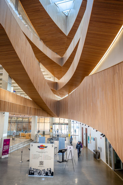 Calgary, Alberta - February 6, 2022: Interior of Calgary`s Central Branch of the Calgary Public Library. The library opened in November 2018 and was designed by renowned Snohetta firm. - Photo, Image