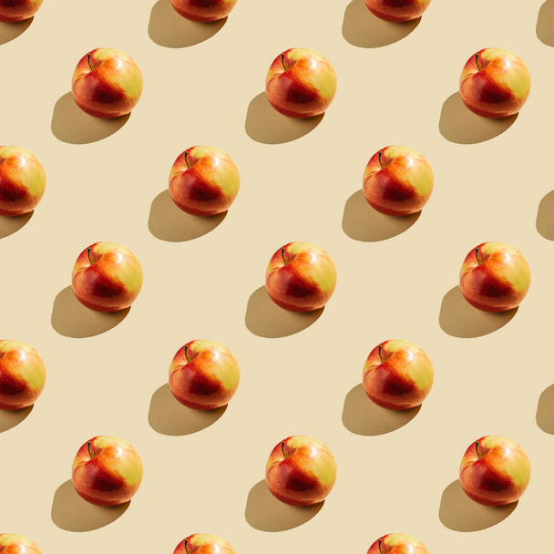 Pattern of apples on a beige background. - Φωτογραφία, εικόνα