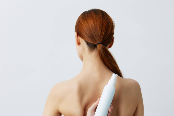 young woman body lotion rejuvenation cosmetics close-up Lifestyle - Zdjęcie, obraz