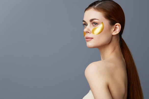 pretty woman skin care face patches bare shoulders isolated background - Photo, Image