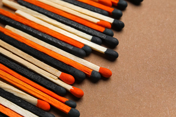Different new matchsticks on brown background, closeup - Photo, Image