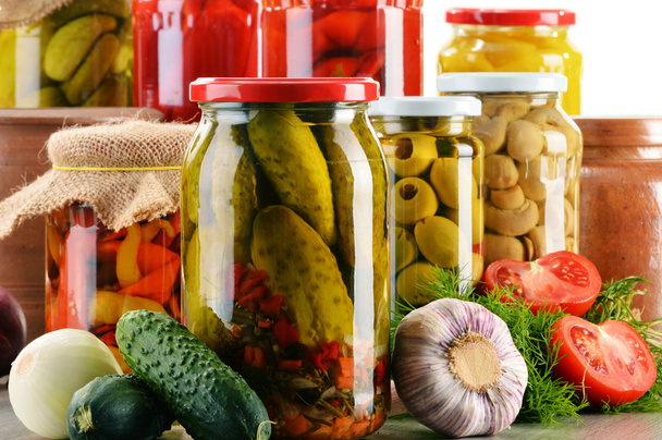 Composition with jars of pickled vegetables. Marinated food - Fotoğraf, Görsel