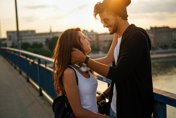 Portrait of happy young couple in love enjoying time together in city. People travel fun happiness concept - Photo, Image