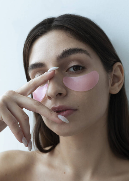 beautiful girl with pink eye patches - Zdjęcie, obraz