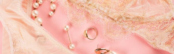 Top view of accessories near lace underwear on pink background, banner  - Photo, Image