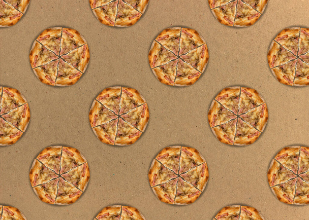 Pizza on a cardboard background. Seamless pattern with cut pizza with bacon. - Photo, image