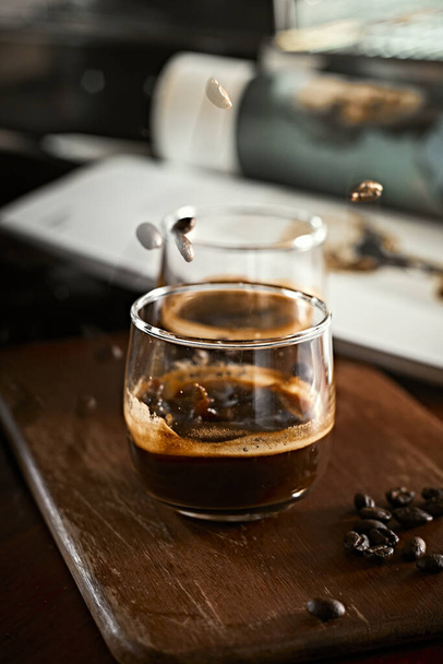 Close up of two espresso in shot glasses.  - Foto, Bild