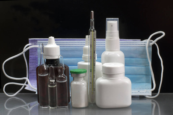 Medical products for protection against coronavirus on a black background - Photo, Image