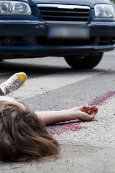 Female pedestrian after accident - 写真・画像