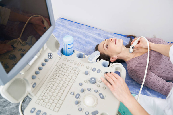 Young patient getting ultrasound exam in clinic - Φωτογραφία, εικόνα
