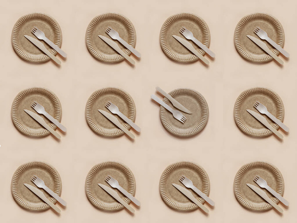 Eco-friendly disposable tableware for food. Repeating pattern with forks, knives and plates over green background. Top view  - Φωτογραφία, εικόνα