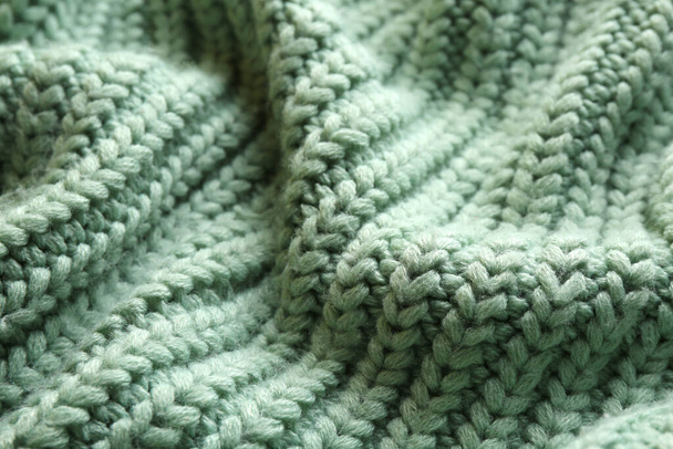 Beautiful pale green knitted fabric as background, closeup - Photo, Image