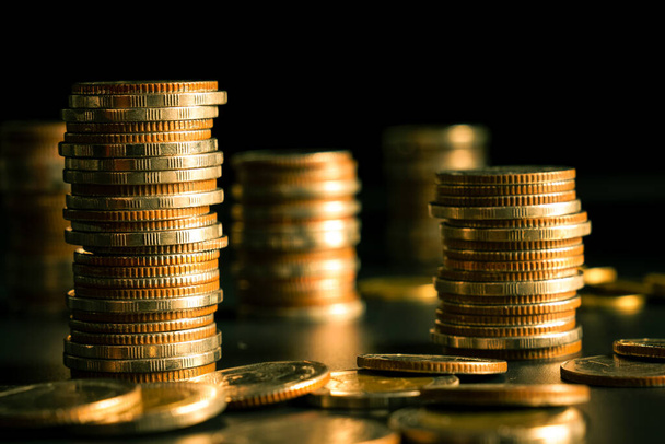 Pile of gold coins money stack in finance treasury deposit bank account saving - Fotoğraf, Görsel