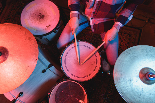 Anonymous musician playing drums during concert - Foto, imagen