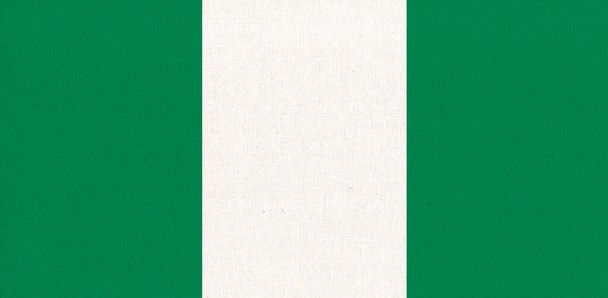 Flagge Nigerias. Nigerianische Flagge auf Stoffoberfläche. Textur. Nationales Symbol. Bundesrepublik Nigeria - Foto, Bild