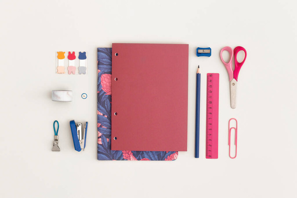 School stationery on white background. Top view with copy space. Flat lay. Back to school concept. - 写真・画像
