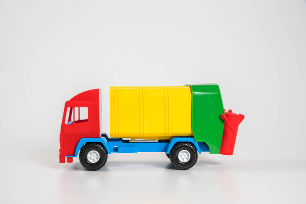 Multi-colored plastic children's toy cars on a white background. - Photo, Image