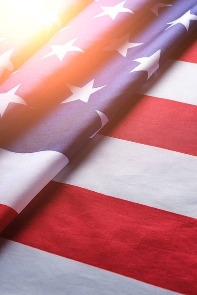 Flag United States of America in bright rays sun.Star spangled flag is symbol democracy and freedom - Фото, зображення