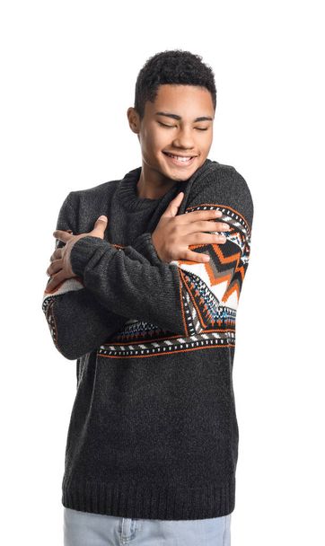 Handsome African-American guy in knitted sweater on white background - Photo, Image