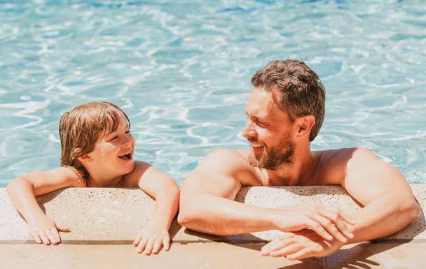Portrait of father and son relax in swimming pool. Pool resort. Happy family face. Copy space. - Foto, immagini