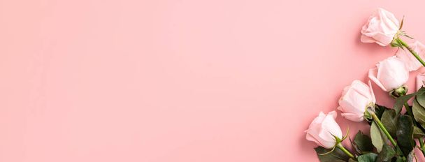 Valentine's Day design concept background with pink rose flower on pink table background background - Fotó, kép