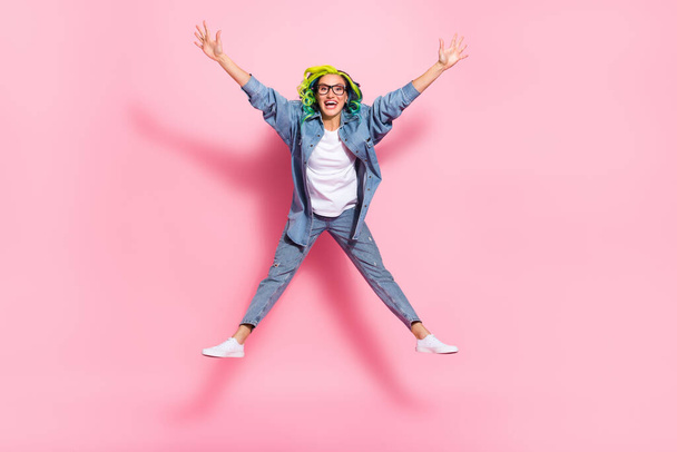 Full length body size view of attractive cheerful wavy-haired girl jumping fooling isolated over pink pastel color background. - Фото, зображення