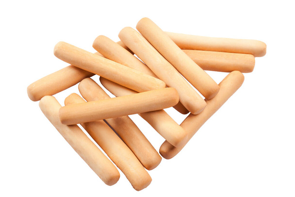 Knapperig brood deeg crackers gevormd tot stokken vorm geïsoleerd op wit - Foto, afbeelding