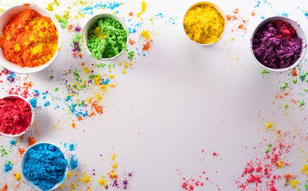 Happy Holi decoration, the indian festival.Top view of colorful holi powder on white background. - Foto, Imagen