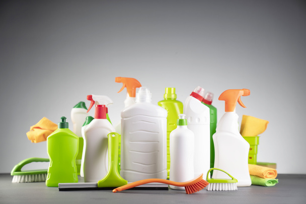 House  and office cleaning products. White and green cleaning kit on gray background. - Photo, Image