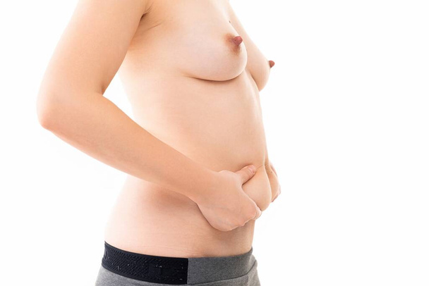 mulher de meia-idade após o parto com dobras no abdômen - Foto, Imagem