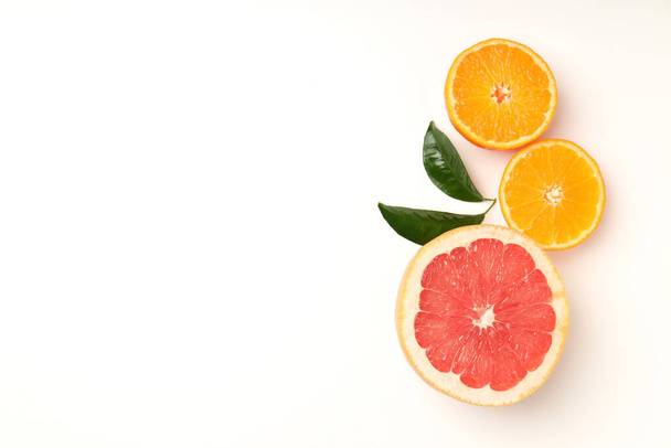 Citrus fruits on white background, space for text - Fotó, kép