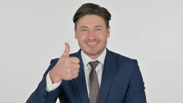 Middle Aged Businessman showing Thumbs Up Sign, White Background - Foto, afbeelding