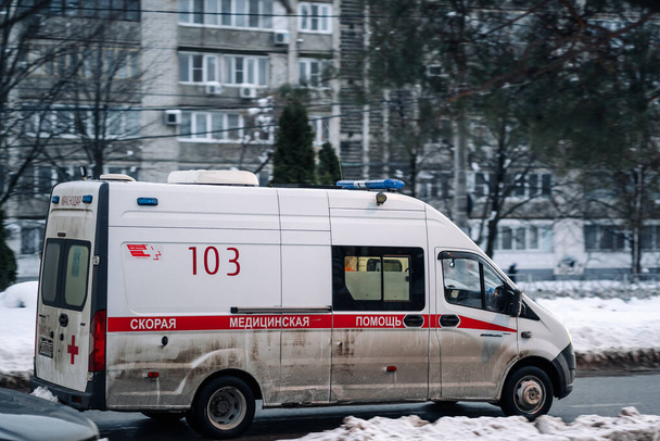 Krasnodar, Russia - January 27 2022: Ambulance van in motion driving down city road. Fast response machine. - 写真・画像
