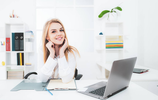 Young beauty business portrait. Beautiful woman working in office. Business people - happy businesswoman or secretary with notebook at office. - Valokuva, kuva