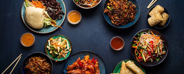 Set of Chinese dishes on table space for text - Photo, Image