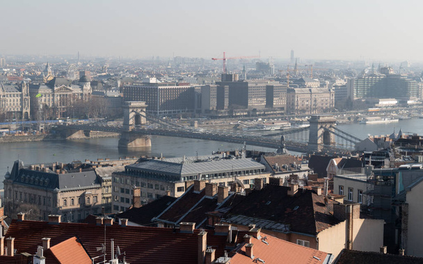 Cityscape of budapest with Szechenyi chain bridge over Danube river under renovation - Foto, Bild