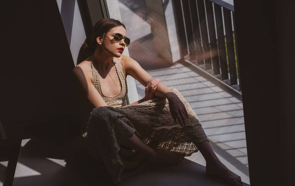 Female sunglasses. Beautiful young woman posing. Sensual model girl with makeup. Young woman vogue style. - Photo, Image