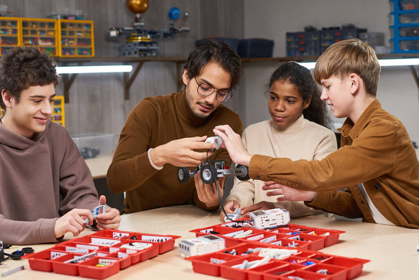 Teacher with Kids in Robotics Class - Foto, Bild