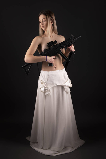 beautiful sexy girl holding gun . - Фото, зображення