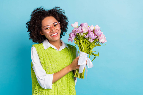 Photo of adorable positive lady receive present on 8 march cute peony bouquet isolated on blue color background - Zdjęcie, obraz