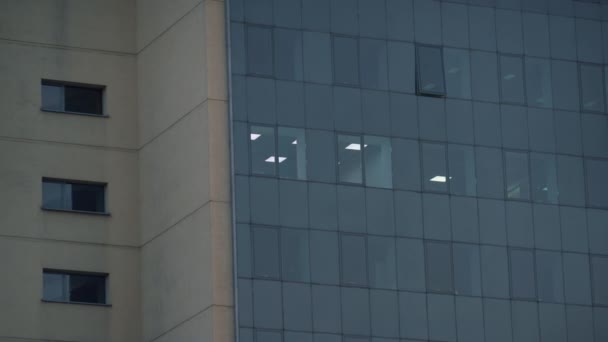 Office building glass exterior light in room drone shot. Downtown real estate. - Footage, Video