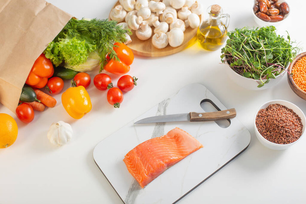 red fish and various vegetables in  kitchen - Foto, Imagen