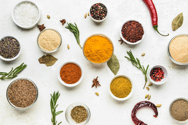 Composition with bowls of different spices on light background - Photo, Image