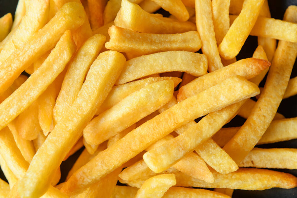 Tasty french fries as background, closeup - Fotó, kép