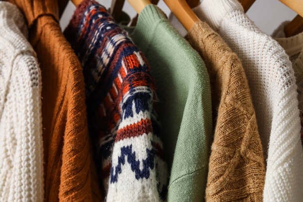 Closeup view of stylish warm sweaters - Фото, изображение
