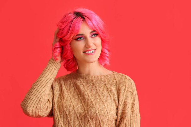 Stylish woman with bright hair on color background - Photo, Image